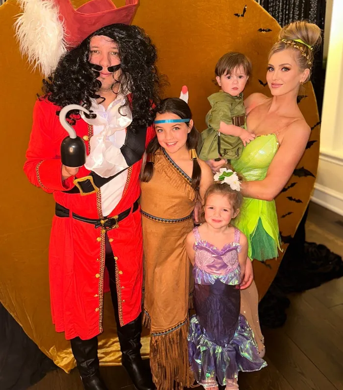 Family dressed as Captain Hook, Tinker Bell, Peter Pan and other Disney favorites.