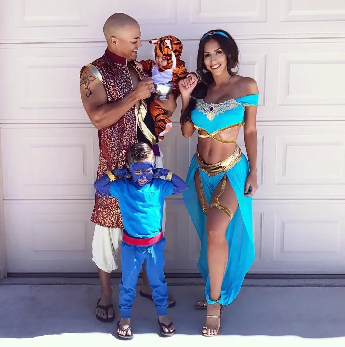Family dressed as Aladdin characters including Jasmine, Aladdin, Genie and Rajah.
